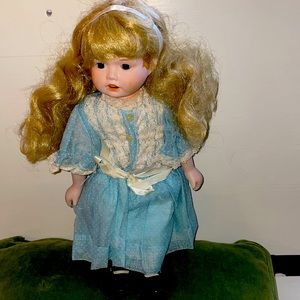 Antique Doll, Porcelain face, hands, feet; Dress is “dotted Swiss” on voile